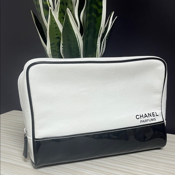 CHANEL Handbags - CHANEL  VINTAGE CHANEL White Canvas with Black Vinyl Cosmetic bag!!! EUC!! 🤍